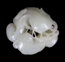 * * A Chinese white jade group of two catfish, 18th century, each fish biting a sprig of lingzhi