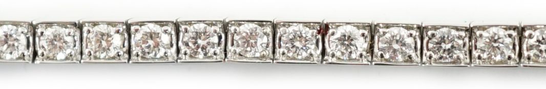A late 20th century Cartier 18ct white gold and diamond set line bracelet, set with sixty one