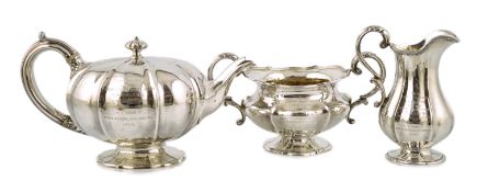 A matched three piece William IV and Victorian silver tea service, the teapot inscribed to 'Field