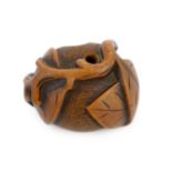 * A Japanese carved wood netsuke of a pumpkin with a stalk and leaves, 19th century, signed