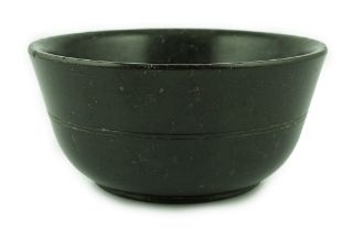 A Chinese snakeskin soapstone bowl, Tang dynasty or later, of plain form with ring turning to the