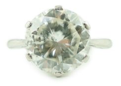 A mid 20th century platinum and solitaire diamond set ring, the round cut stone weighing
