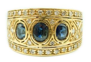 An Italian Byzantine style 18k gold, sapphire and diamond cluster ring, set with graduated oval