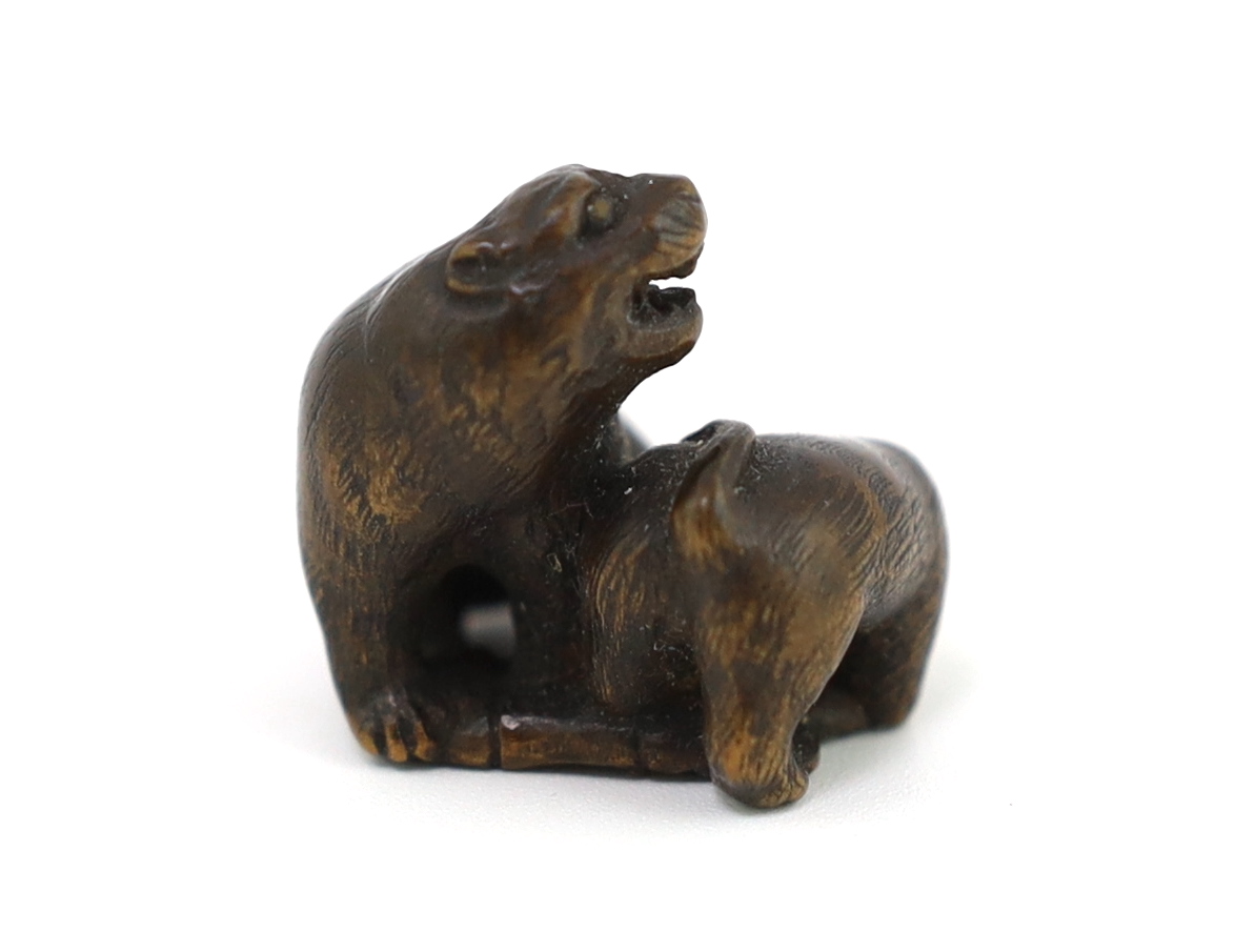 * A Japanese carved wood netsuke of a tiger and cub, 19th century, unsigned, 2.2cmProvenance: J. - Image 3 of 5