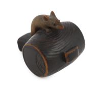 * A Japanese carved wood rat netsuke, early 19th century, formed as a rat, with inlaid eyes,