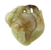 A Chinese pale celadon and russet jade carving of peaches and two bats, 17th century, the stone with