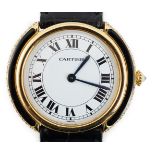 A lady's 18ct gold, black onyx and diamond set Cartier Vendome manual wind wrist watch, with Roman