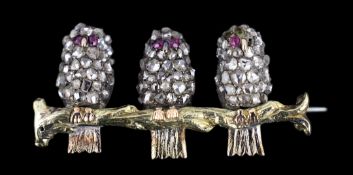 An antique gold, silver and rose cut diamond set novelty brooch, modelled as three owls on a branch,