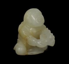 * A Chinese white and russet carved jade figure of Liu Hai, 17th century, modelled kneeling,