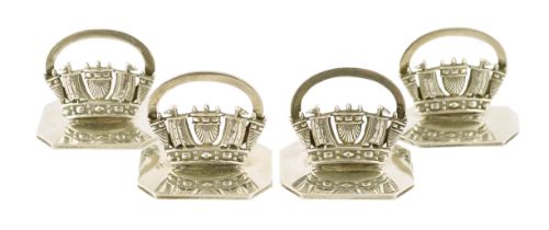 A set of four George V silver Royal Navy & Merchant Services menu holders, by John William