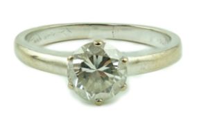 A modern 18ct white gold and solitaire diamond ring, the round brilliant cut stone weighing