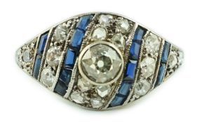 A 1940's/1950's 18ct white gold, sapphire and diamond set cluster ring, the central diamond
