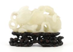 * A Chinese white jade carving of a cluster of melons, 18th century, with stalks and leaves, two
