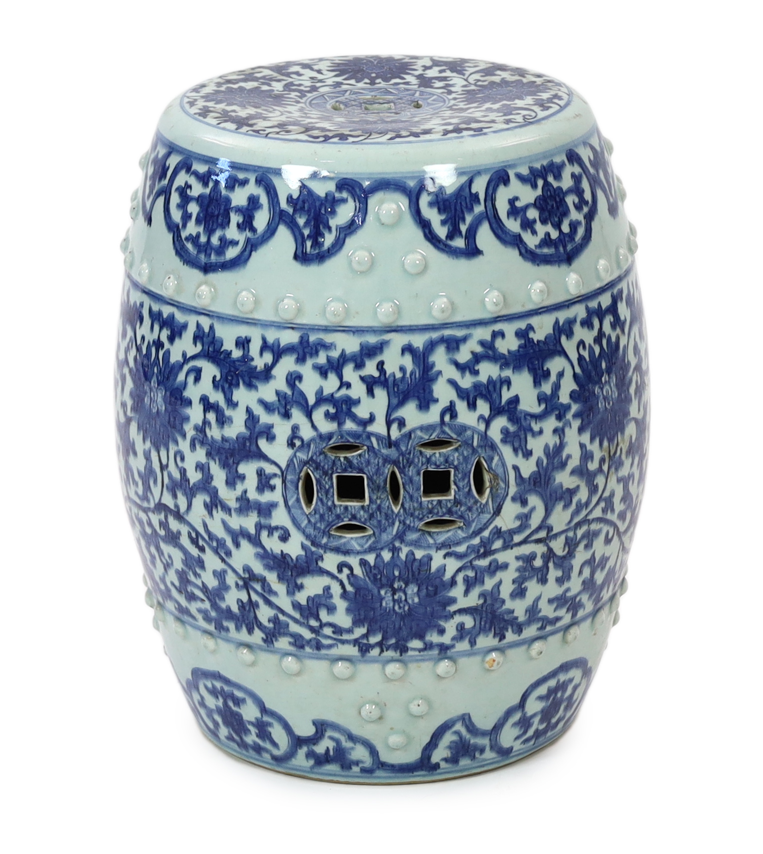 A Chinese blue and white porcelain stool, 19th century, painted with lotus flowers and scrolling