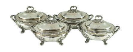 Benacre Hall, Suffolk. A good set of four Victorian silver two handled oval sauce tureens and