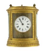 Drocourt & Co., a late 19th century French hour repeating ormolu oval cased carriage clock, with