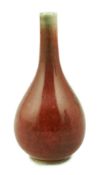A Chinese copper red small bottle vase, 18th/19th century, of pear shape, underglaze blue double