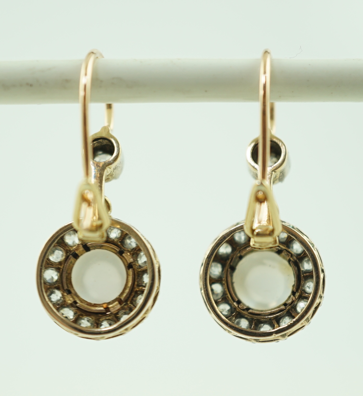 A pair of early 20th century gold, moonstone and old round cut diamond set cluster drop earrings, - Image 2 of 3