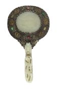 A Chinese celadon jade mounted hand mirror, the jade 18th/19th century, the back of the mirror