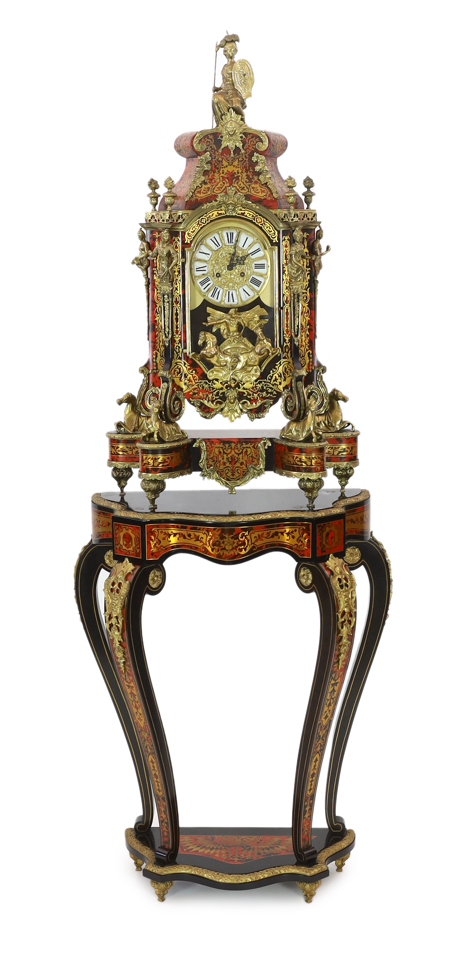A Louis XV style brass mounted red boulle mantel clock on matching stand, with Britannia finial,