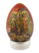 * * A Russian lacquer Easter egg, attributed to Lukutin, mid 19th century, finely painted with the