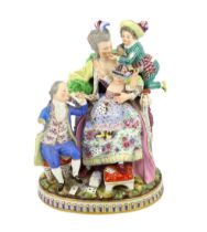 A Meissen group The Good Mother, 19th century, with good detail to the clothing, playing cards and