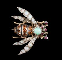 A late Victorian gold and silver, white opal, ruby and citrine? cluster set bug brooch, 27mm,