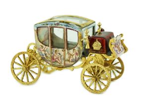 An early 20th century Viennese silver gilt and enamel miniature model of carriage, by Ludwig