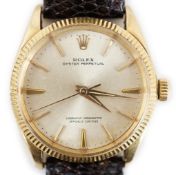 A gentleman's mid 1960's 18ct gold Rolex Oyster Perpetual wrist watch, currently on an associated