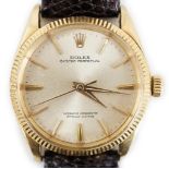 A gentleman's mid 1960's 18ct gold Rolex Oyster Perpetual wrist watch, currently on an associated