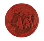 * A Chinese cinnabar lacquer circular box, Qianlong period, the lid carved with a scholar and
