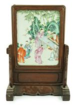 A Chinese famille rose porcelain mounted hongmu framed table screen, 19th century, the porcelain