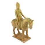 * A Chinese straw glazed pottery model of a horse and female rider, Tang dynasty (618-906 AD),