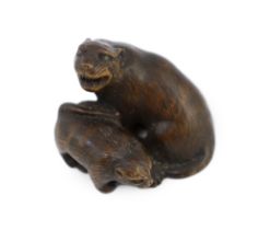 * A Japanese carved wood netsuke of a tiger and cub, 19th century, unsigned, 2.2cmProvenance: J.
