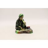 A Royal Doulton figure of The Snake Charmer HN1317, signed EL, 11.5cm***CONDITION REPORT***PLEASE