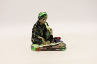 A Royal Doulton figure of The Snake Charmer HN1317, signed EL, 11.5cm***CONDITION REPORT***PLEASE