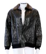 A Yves Saint Laurent Fourrures gentlemen's black quilted leather bomber jacket with fur collar and