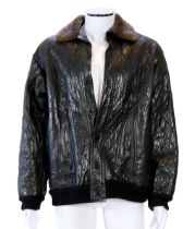 A Yves Saint Laurent Fourrures gentlemen's black quilted leather bomber jacket with fur collar and