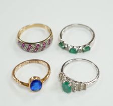Three assorted modern 9ct gold and gem set rings including emerald and diamond chip set half hoop,