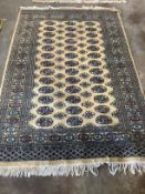 A Bokhara style cotton pile rug, 192 x 124cm***CONDITION REPORT***PLEASE NOTE:- Prospective buyers