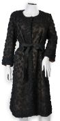 A Nicole Farhi lady's black lace knee length jacket with flower embellishment all over with black