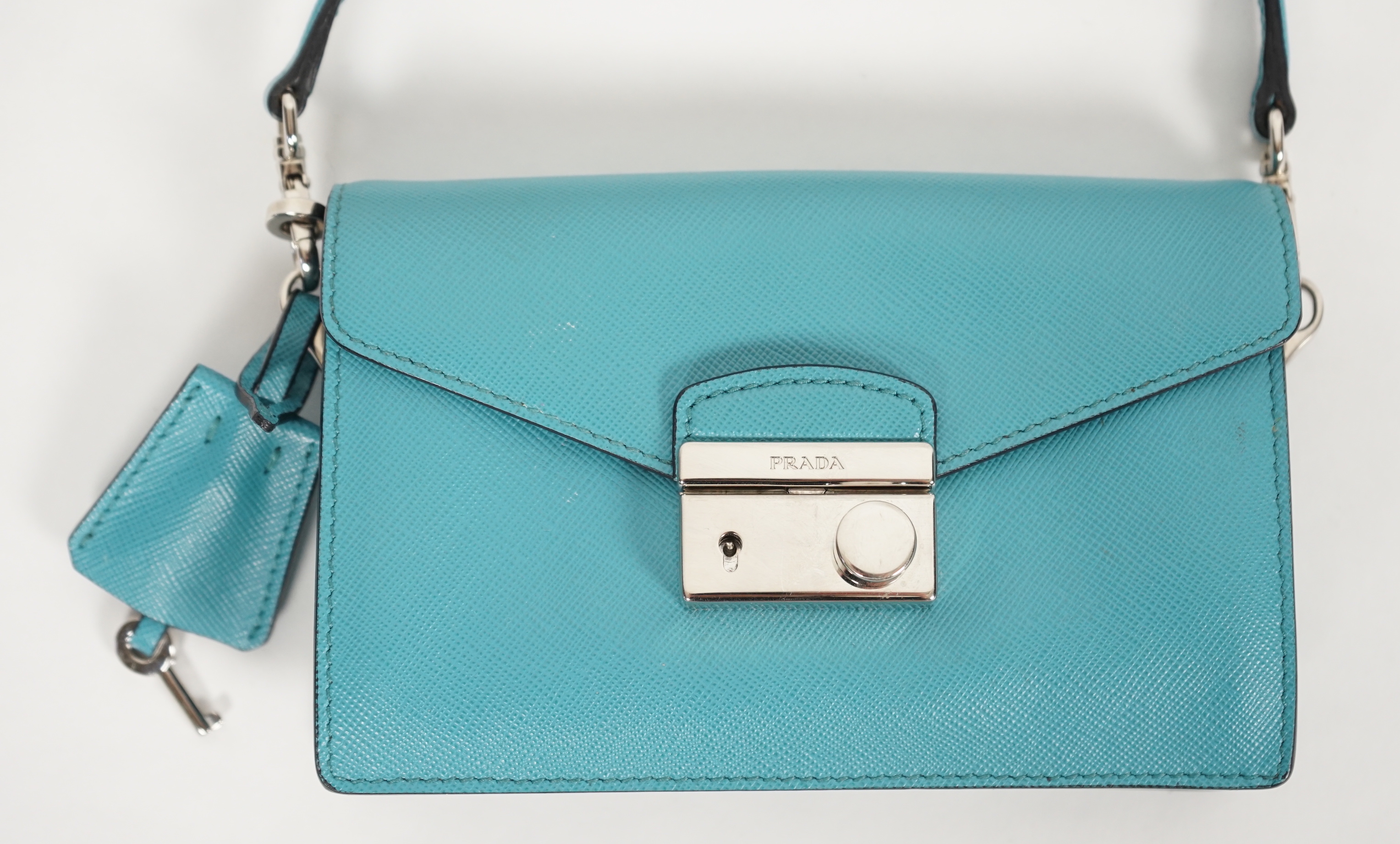 A Prada Saffiano Lux Mini Sound bag in Turchese, silver-tone hardware, with bag, box and - Image 3 of 8
