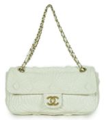 ** ** A white quilted Chanel shoulder bag, with maker’s dust bag, Authentication no: 13198167 (no
