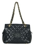 ** ** A Chanel Classic Petit Timeless Tote in black caviar with gold hardware, Authentication no: