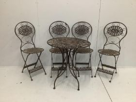 A cast iron garden table and four folding chairs***CONDITION REPORT***PLEASE NOTE:- Prospective
