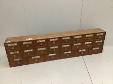 A nest of pine pharmacist's drawers, width 183cm, height 49cm***CONDITION REPORT***PLEASE NOTE:-