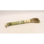 A mixed carved jadeite fly whisk, 39cm long***CONDITION REPORT***PLEASE NOTE:- Prospective buyers