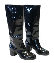 A pair of Chanel lady's black patent knee high mid heel rain boots, with CC to the outside ankle