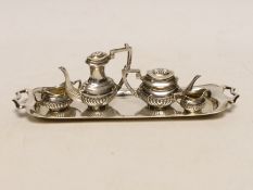 An Elizabeth II silver miniature four piece tea set and two handled tea tray, by Mappin & Webb,