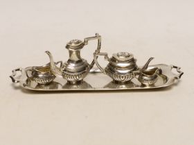 An Elizabeth II silver miniature four piece tea set and two handled tea tray, by Mappin & Webb,